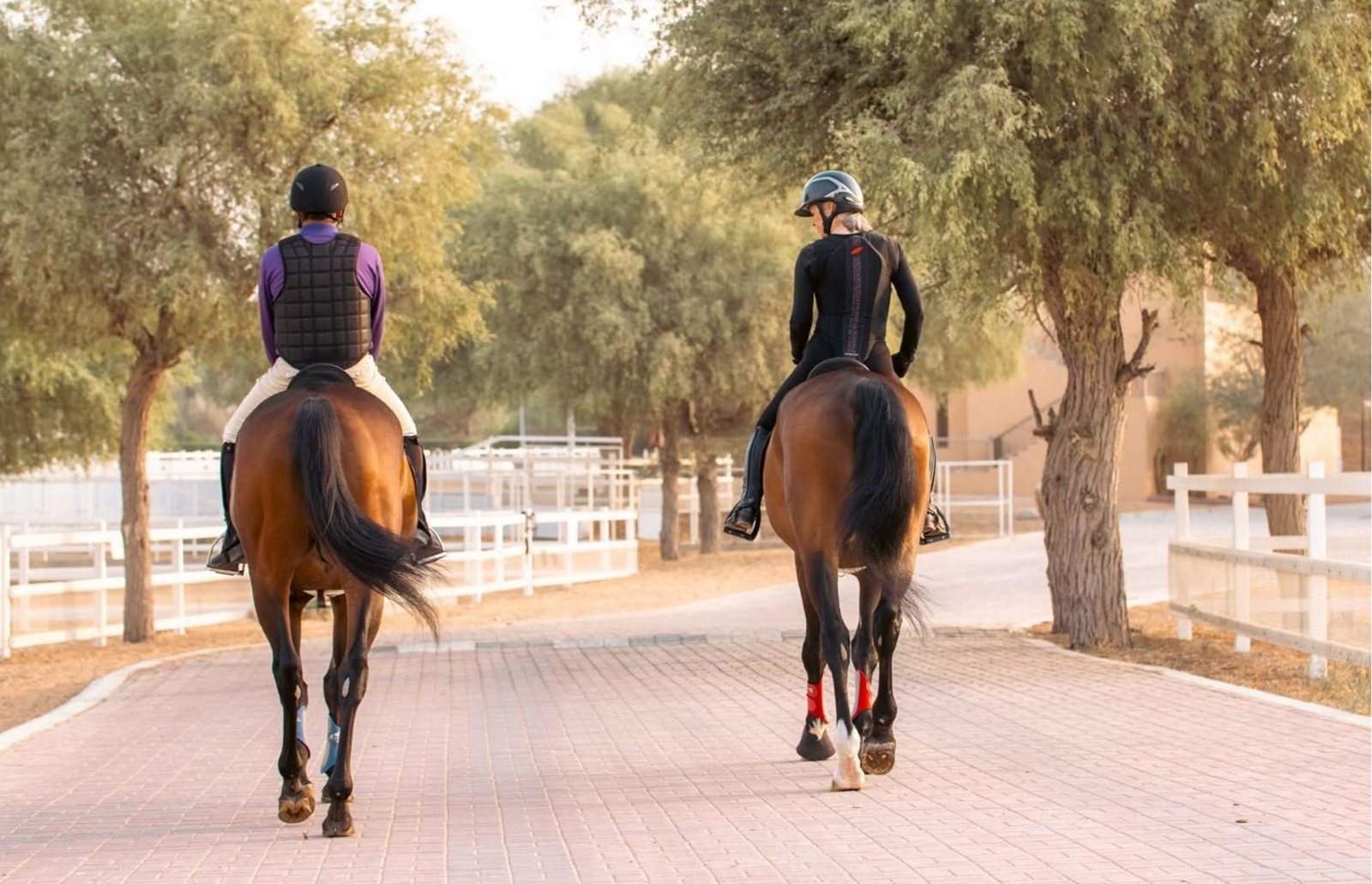 Two riders on the trail at Al Wadi Equestrian Center